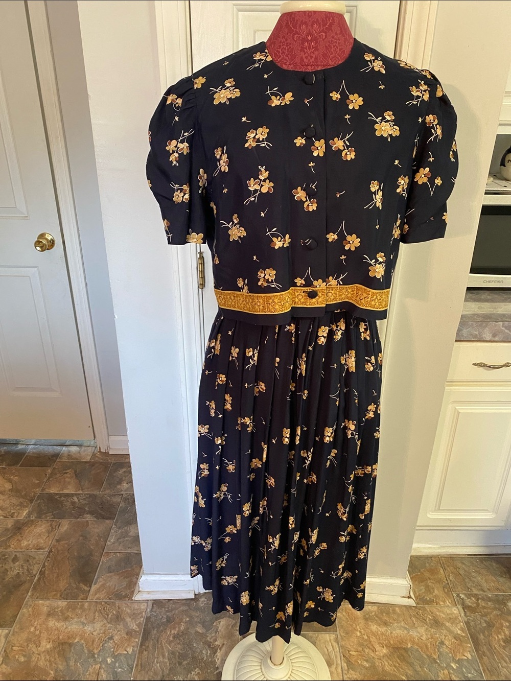 Karin Steven’s Navy Floral Two-Piece Dress with Gold Floral Accents